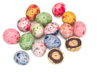 chocolate peanuts with colored glaze isolated on white background