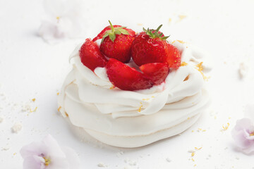 Homemade meringue dessert Pavlova cake with fresh strawberries and mint. Summer dessert. French cake. Confectionery. Classic dessert. Strawberry dessert