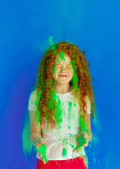 red-haired girl in holi paints