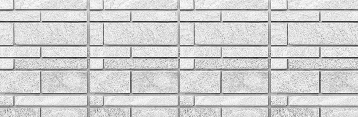 Panorama of Block pattern of white stone cladding wall tile texture and seamless background
