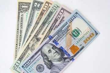 Stack of money American dollar bills on a white background. The concept of buying for dollars