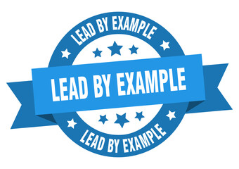 lead by example round ribbon isolated label. lead by example sign