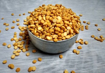 A full bowl of split chickpea. The chickpea or chick pea, Its different types are variously known as gram or Bengal gram, garbanzo or garbanzo bean, Egyptian pea. Chickpea seeds are high in protein