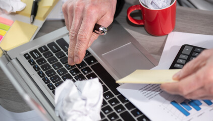 Businessman working on a messy desk