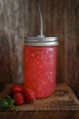 strawberry jam on a wooden table