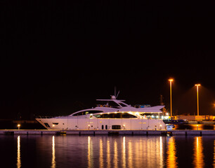 a yacht moored at night in the mediterranean sea