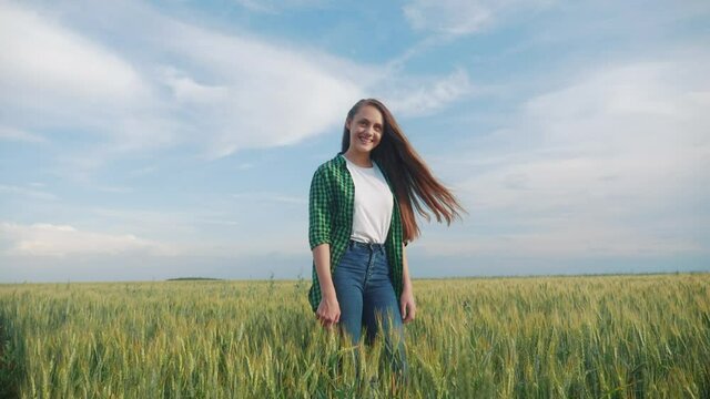 teen girl rejoices standing in the field to meet the sunlight hair flutter. daughter happy family freedom freedom dreams people outdoors childhood concept. girl sister farmer portrait wheat field in