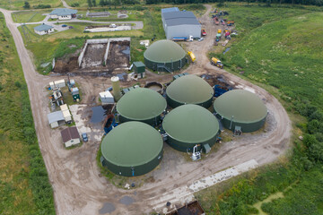 Aerial view of green biogas plant storage tanks