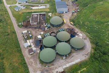 Aerial view of green biogas plant storage tanks