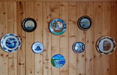Spassk Ryazan. The Ryazan region. Russia. November 14.2018. Collection of decorative plates on the wooden wall of a rural house.