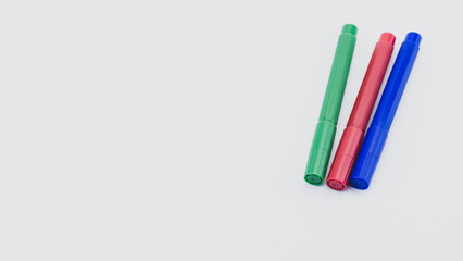 red green blue felt tip pens on white background