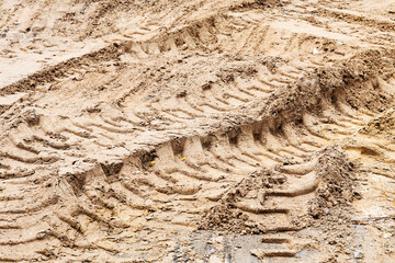 Footprints in the sand car in back light morning light. Selective focus, space in the zone blurring compositions for the production of advertising.