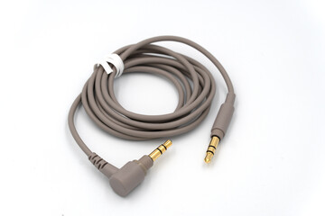 3.5mm audio cable for wireless headphone in isolated white backround.