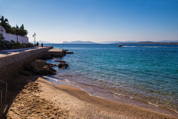 Amazing  tropic scene of  Palm leaves and Yacht  moving from Island Spetses in sunbeams