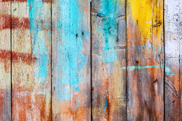 Background gloomy charred wooden fence in dark colors