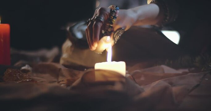 Young woman shaman performing dark magic ritual