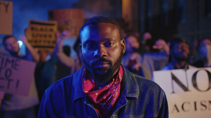 African american severe protester standing in shouting crowd fighting for equal people rights and freedom. Stop racism demonstration. I can't breathe. Black lives matter.