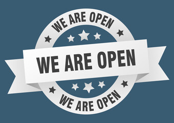 we are open round ribbon isolated label. we are open sign