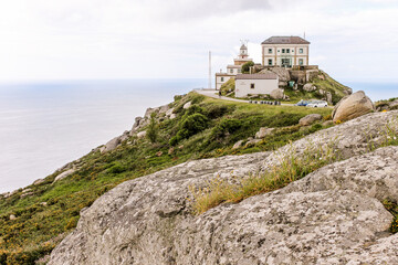 Fototapeta na wymiar Fisterra, Spain. The lighthouse at Cabo Finisterre (Cape Finisterre), final point of the Way of St James (Camino de Santiago)