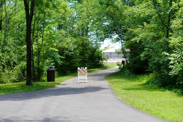 The closed path in the park on a summer day.