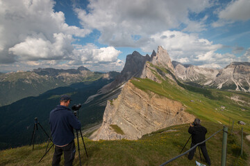 Photographers taking pictures of Odles group seen from Seceda.