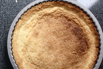 Freshly Baked Tart Base in Tin. Making Boston Banoffee Pie.