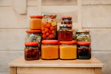 homemade preserved vegetables and jam in jars