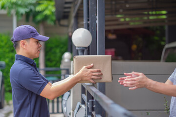 Consignor deliver parcel to customer with smile at home.