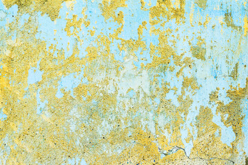 Abstract creative background of chaotic strokes of old cracked paint on concrete wall. Old surface with traces of paint, weathered, scratches and cracks for design