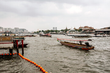 Obraz premium Water taxi and public boats on the river in Bangkok, Thailand