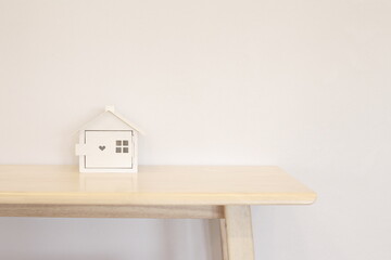 Wooden table and house model