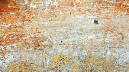 Abstract creative background of chaotic strokes of old cracked paint on concrete wall. Old surface with traces of paint, weathered, scratches and cracks for design