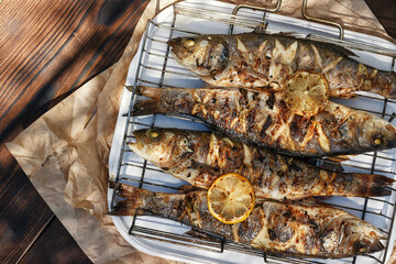 Sea Bass fish cooked on coals in a grill