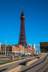 Blackpool seafront and promenade with a blue cloudless sky including the Blackpool Tower, Lancashire, UK