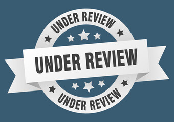 under review round ribbon isolated label. under review sign