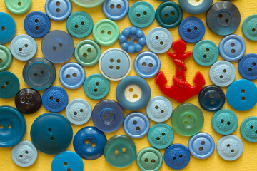Fototapeta premium sea of sewing buttons with red anchor-button 