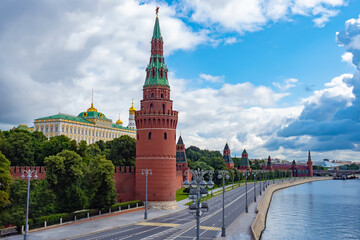 Fototapeta premium Moscow. Russia. The Kremlin wall is made of red brick. Kremlin tower. Kremlin embankment. Panorama of Moscow on a cloudy day. Moscow in the summer. Architecture Of Russia.