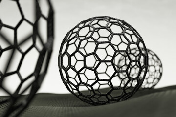 Fototapeta na wymiar 3D rendering of fullerene spheres on white background, black atoms and bonds