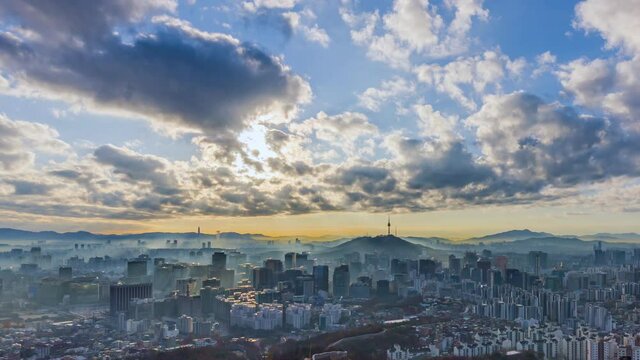 Seoul city modern building with Beautiful clouds flow through the Seoul tower in the morning in downtown Seoul, South Korea. Scenic Area in Seoul, the capital from inwangsan mountain best landmark