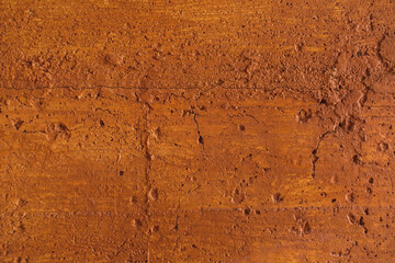 Traditional moroccan terracotta colored background. Orange or ocher clay wall texture. Painted...