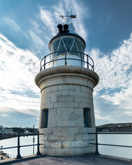 Folkestone / England - August 07 2020: Restored Lighthouse, Folkestone Harbour Arm.