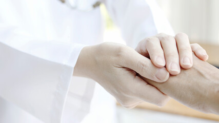doctor's hand touches the patient Concepts of disease and encouragement Working as a doctor reserve a hospital