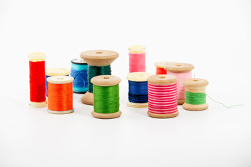 Antique spools of thread multicolored on a white background room for copy space
