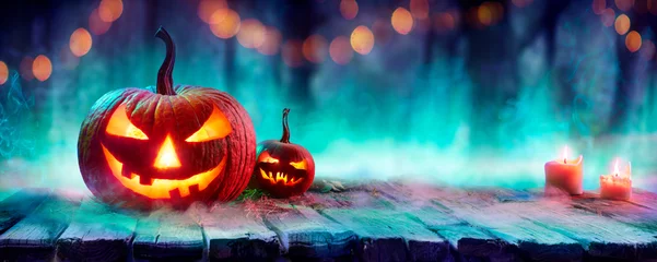 Foto op Plexiglas Jack O’ Lanterns In Spooky Forest With Fog And Candles - Halloween Background With Colors Trend  © Romolo Tavani