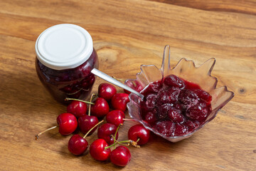 homemade cherry jam on the table with fresh cherries