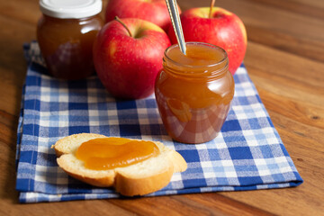 Homemade apple jam. Slice of bread with jam on top.