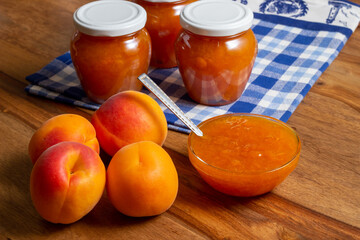 homemade apricot jam on the table with fresh apricots