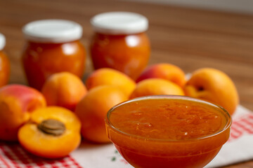 homemade apricot jam on the table with fresh apricots