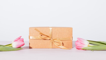 Gift box with beige ribbon