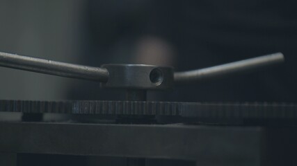 Obraz premium Jeweler makes jewelry of silver. The jeweler to melt silver, makes patterns on it, grinds, cuts and drills. work gas torch